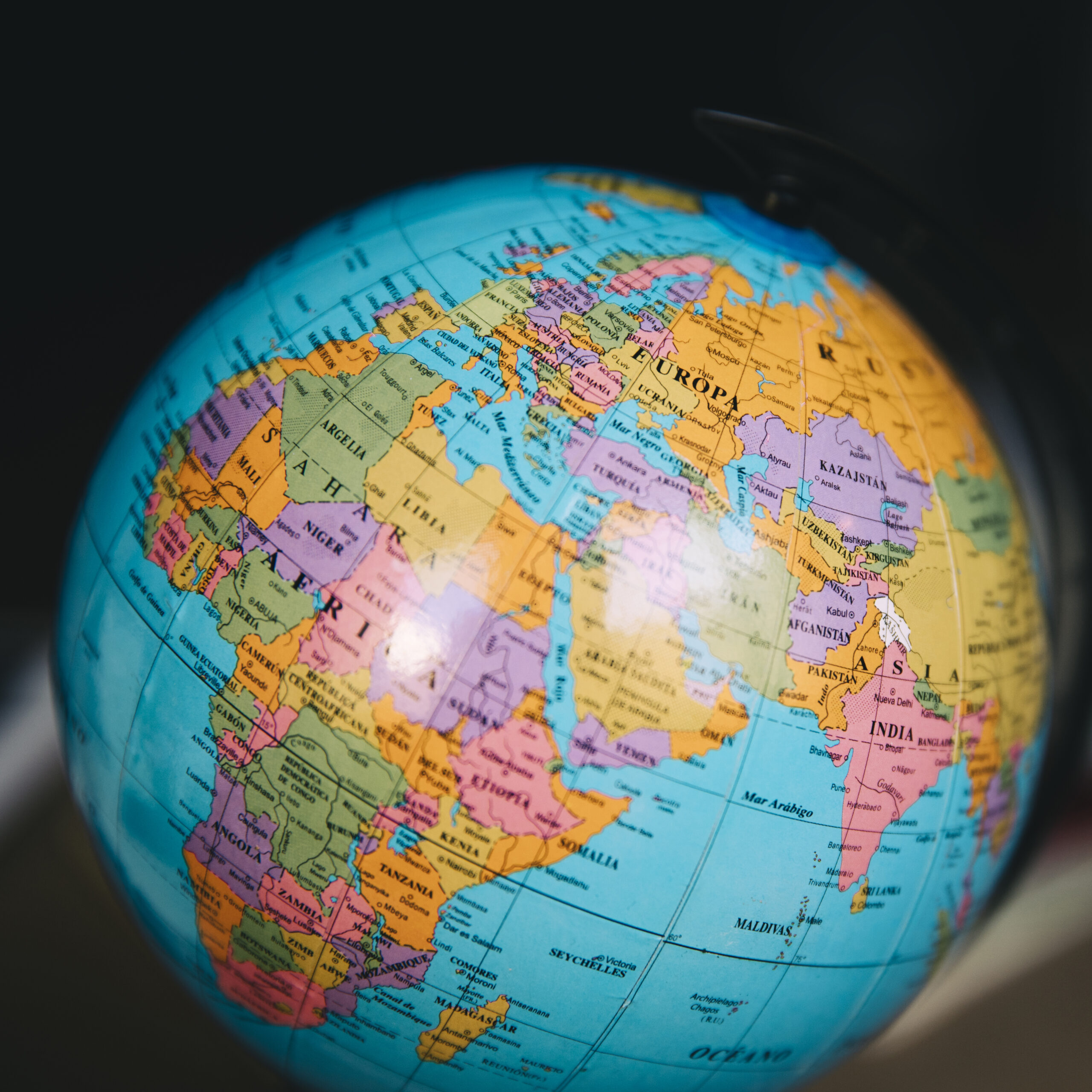 A close-up of a globe highlighting various countries, representing global trade, reshoring strategies, and international supply chain reconfiguration for businesses.