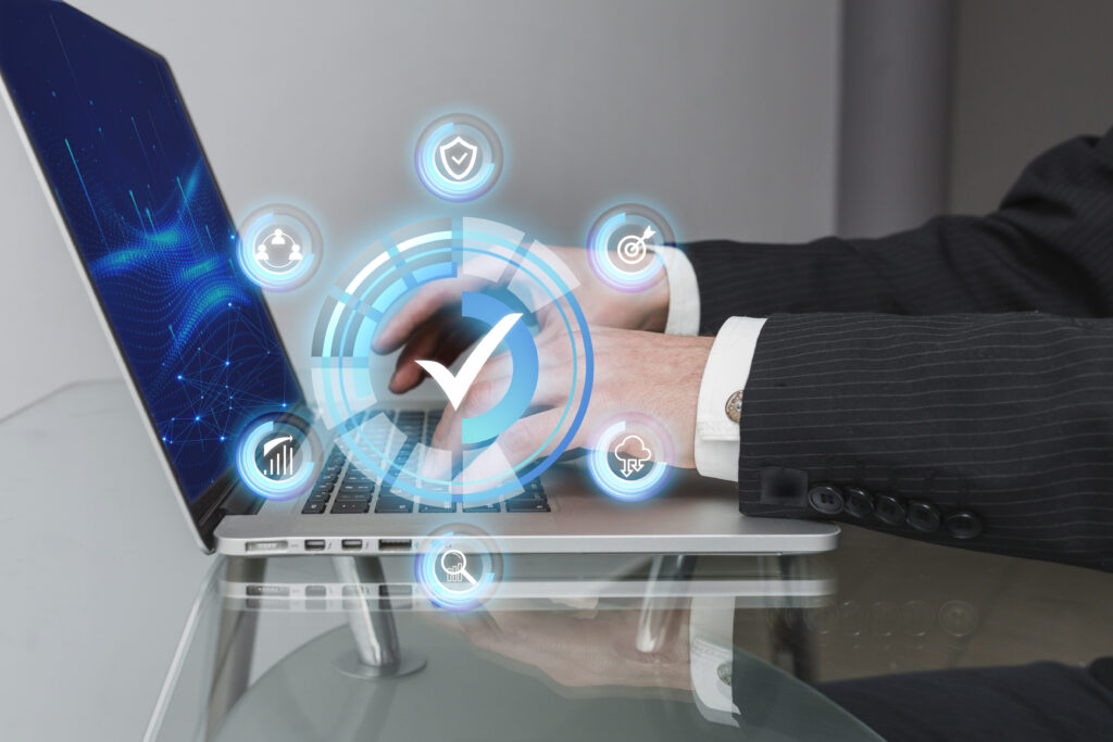 A futuristic representation of digital supply chain management, featuring a hand interacting with a holographic interface on a laptop. The image symbolizes seamless business connections, global sourcing, and import-export solutions facilitated by technology.